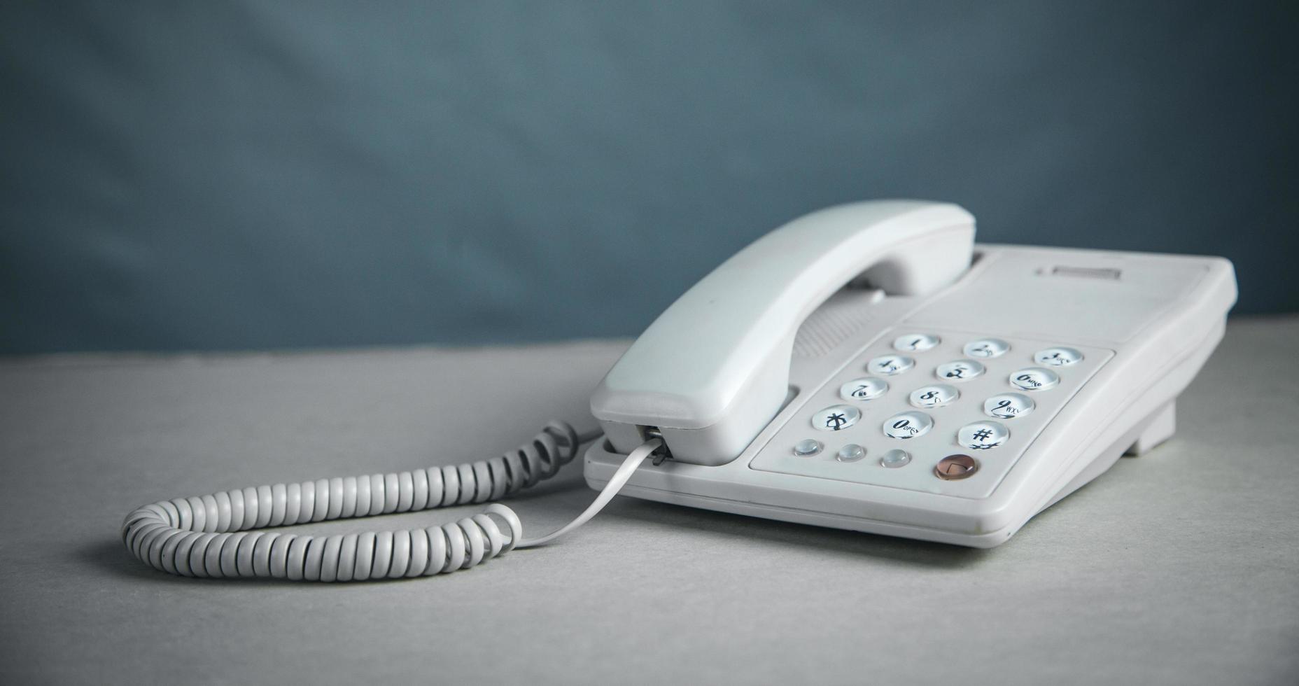 Office phone in the office desk. photo