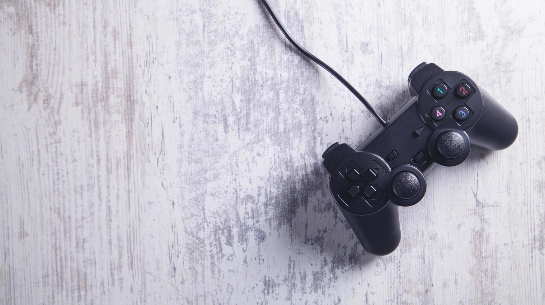 Game controller on white desk. photo