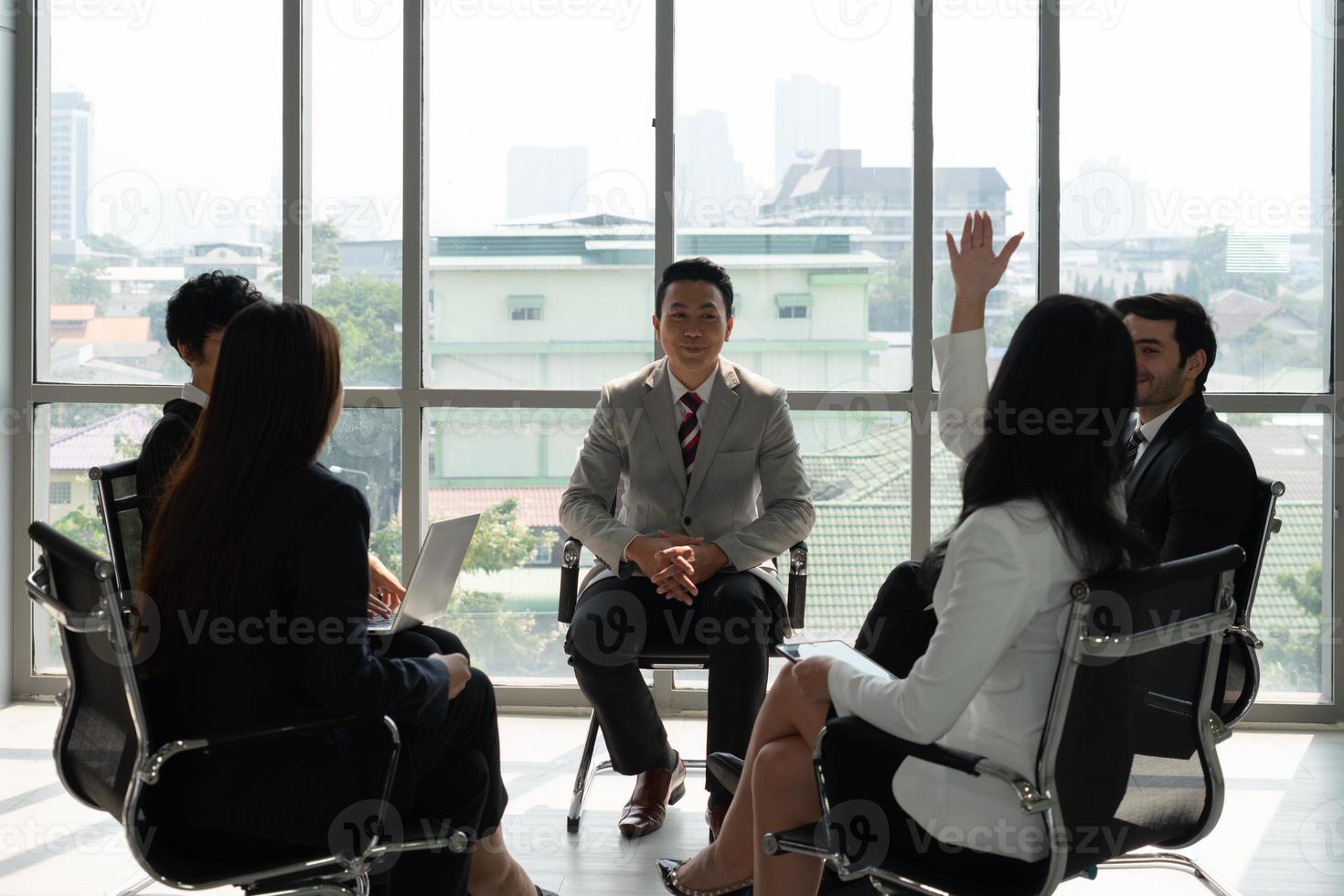 international business team including caucasian and asian people discuss about new project in meeting photo