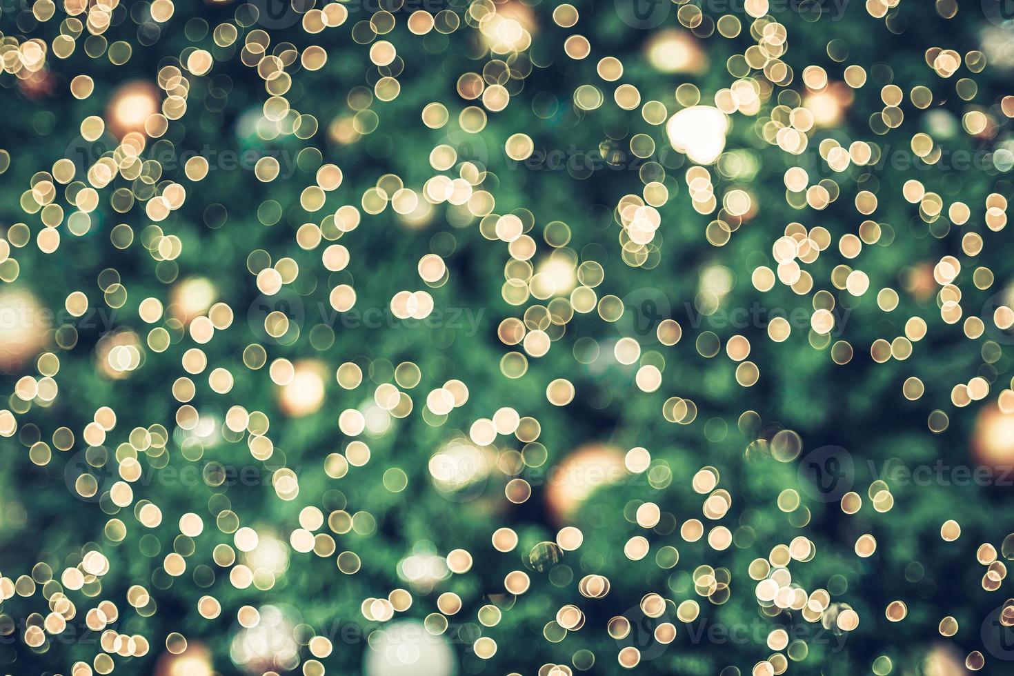 Abstract blur decoration ball and light string on christmas tree with bokeh photo