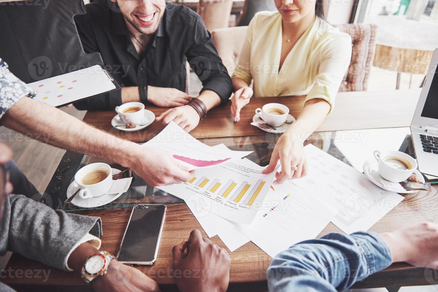 Group of casually dressed businesspeople discussing ideas. Creative professionals gathered for discuss the important issues of the new successful startup project. Teamwork Brainstorming concept photo