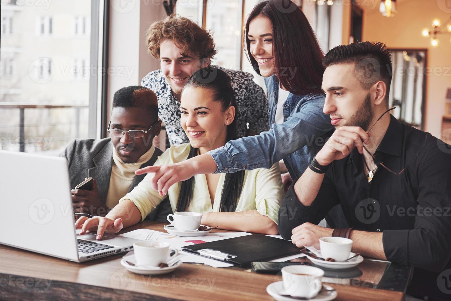 Group of casually dressed businesspeople discussing ideas. Creative professionals gathered for discuss the important issues of the new successful startup project. Teamwork Brainstorming Concept photo