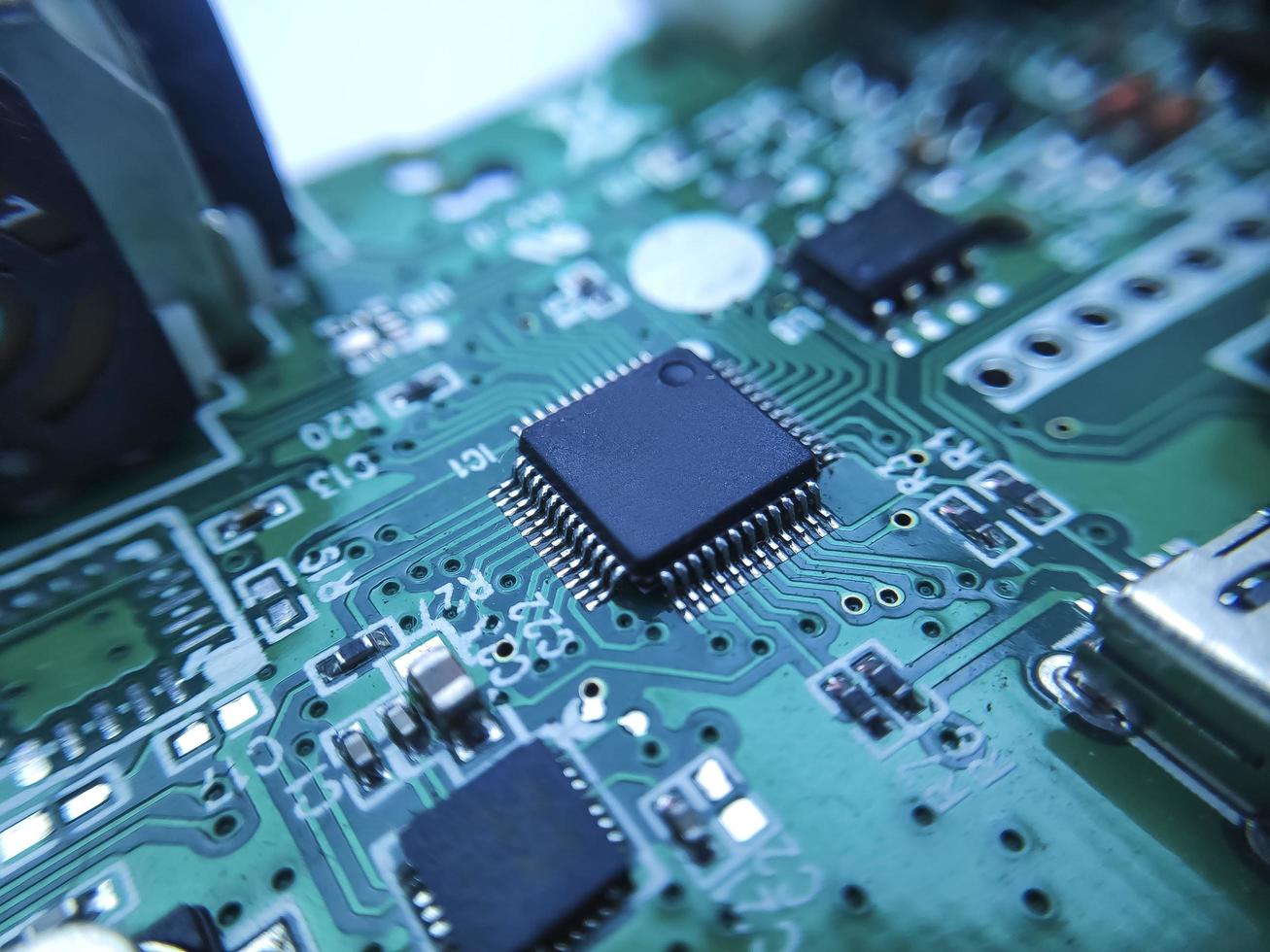 Close up image of microchip. Integrated circuit IC macro photograph. photo