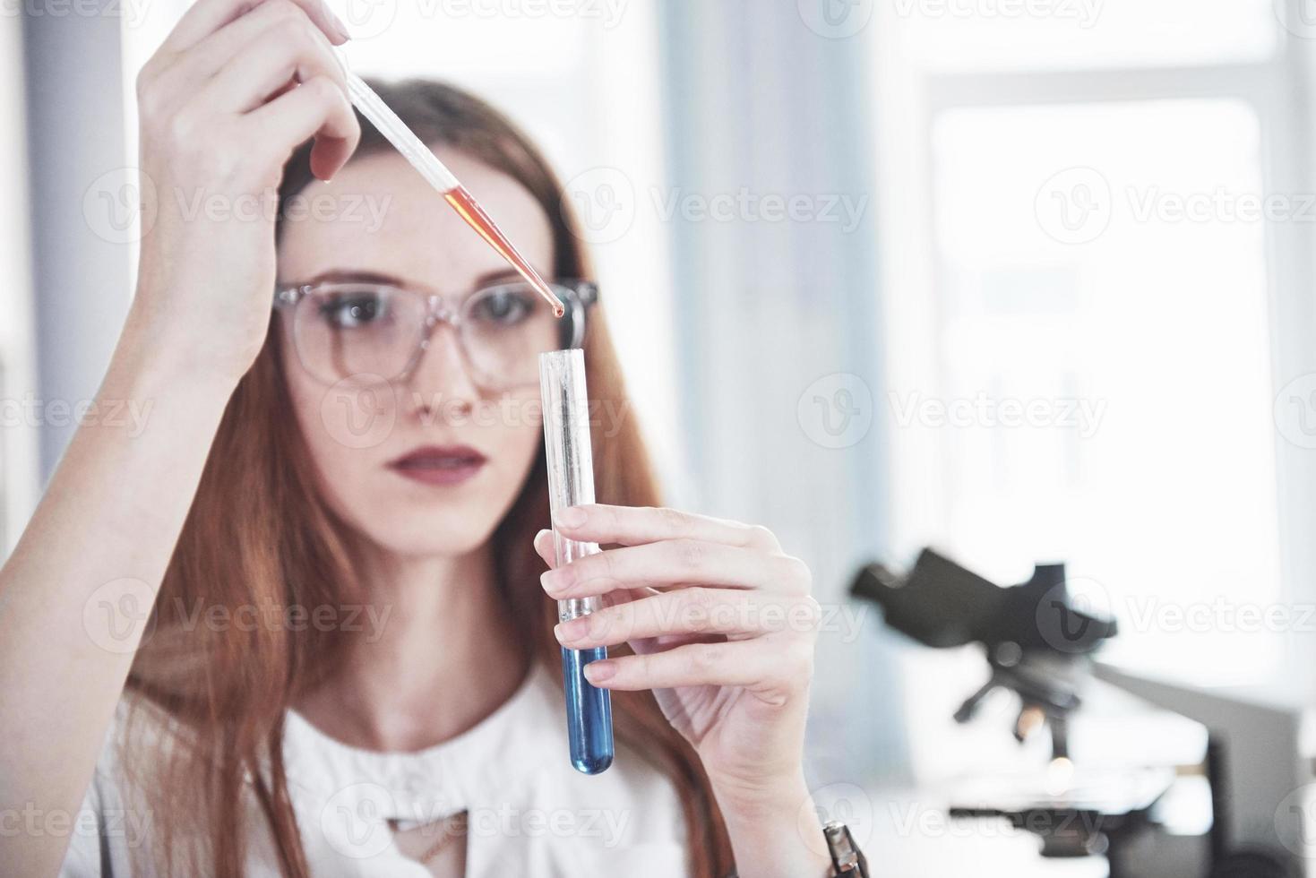 Experiments in the chemical laboratory. An experiment was carried out in a laboratory in transparent flasks photo