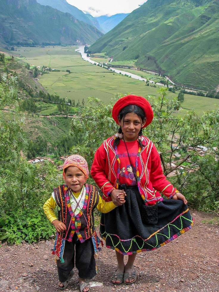 PISAC, PERU, MARCH 2, 2006 - Unidentified children at Mirador Taray near Pisac in Peru. Mirador Taray is a scenic vista along the highway overlooking Sacred Valley of the Incas. photo