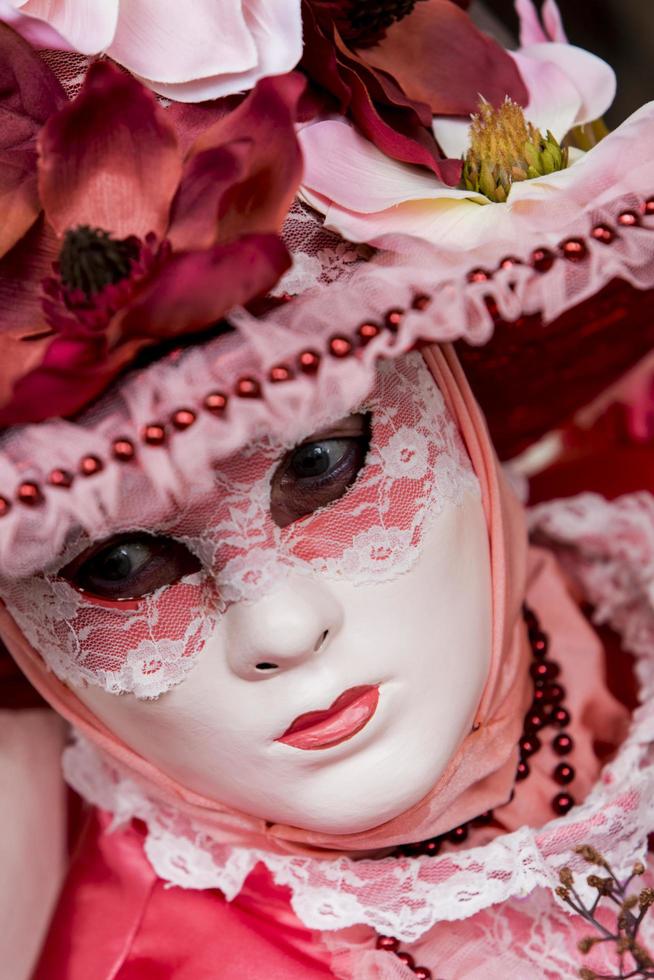 VENICE, ITALY, FEBRUARY 10, 2013 - Unidentified person with Venetian carnival mask in Venice, Italy. At 2013 it is held from January 26th to February 12th. photo