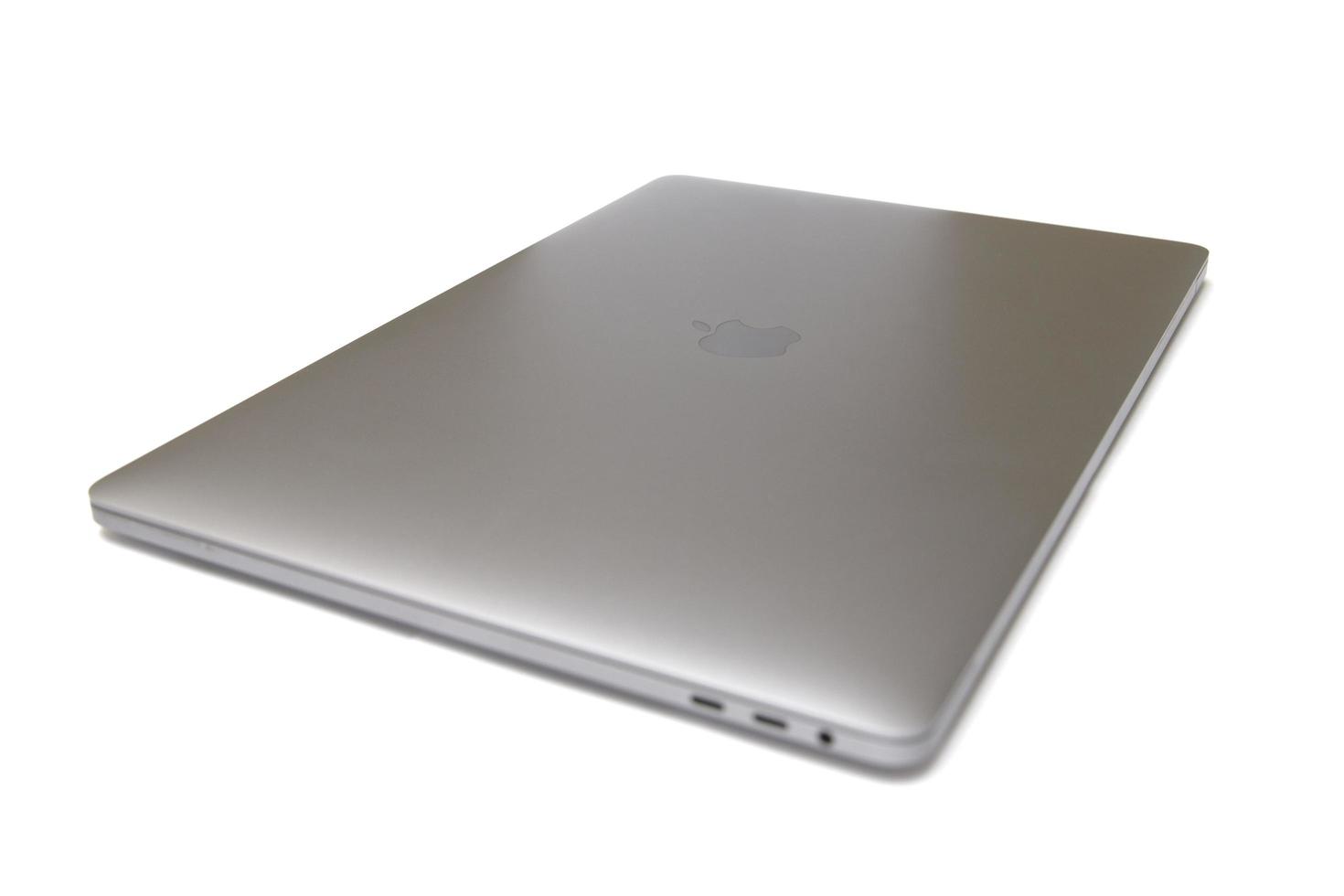 BELGRADE, SERBIA, JULY 18, 2020 - MacBook computer isolated on white. The MacBook is a brand of notebook computers manufactured by Apple Inc. photo