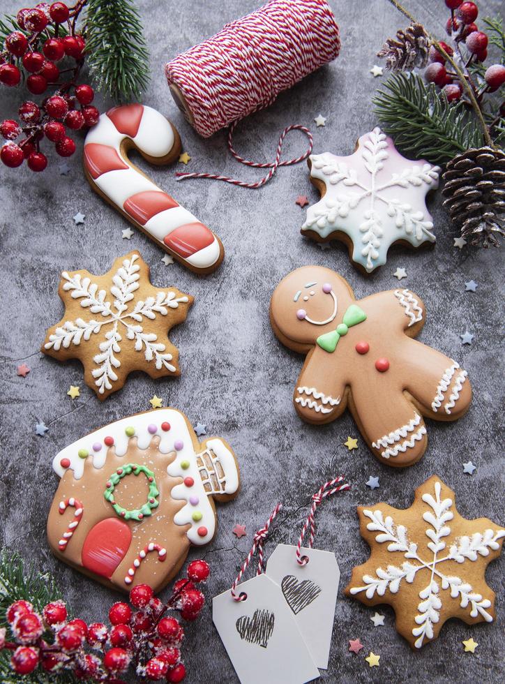 Christmas gingerbread cookies on dark background photo