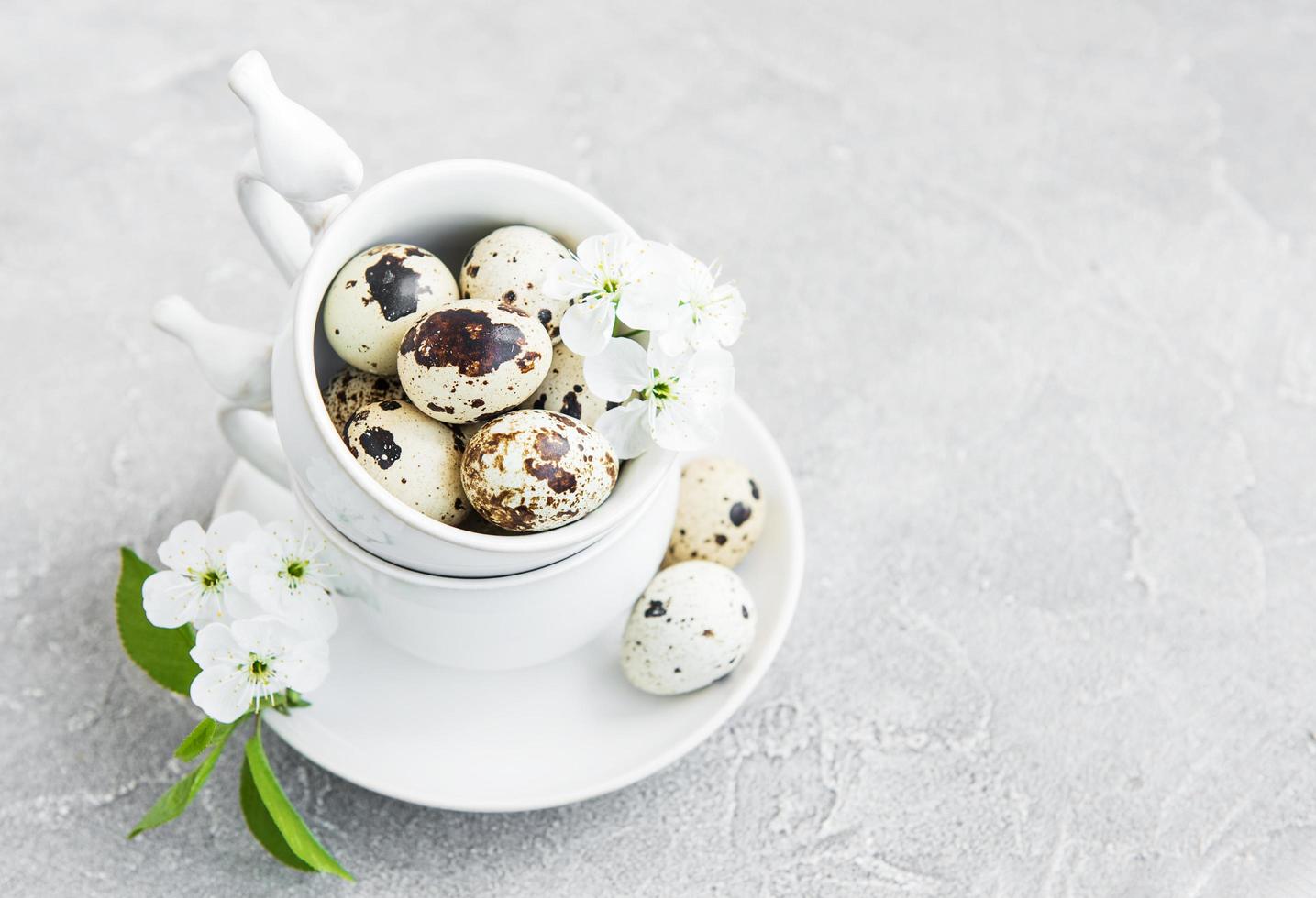 Cup with quail eggs photo