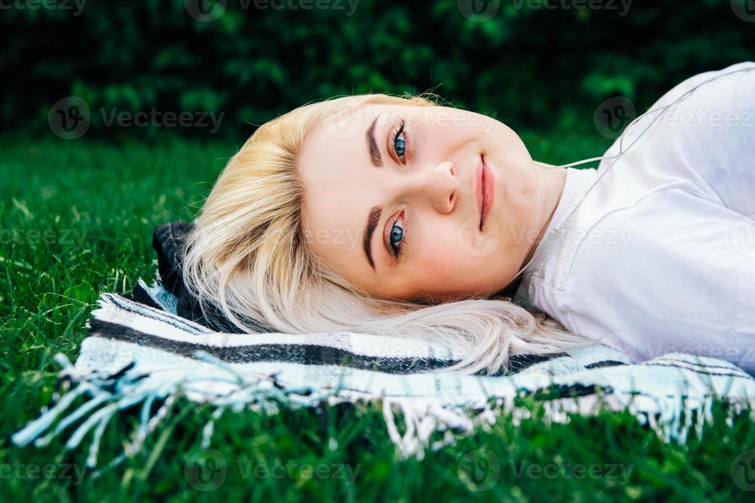 Woman in headphones on green background on green background photo