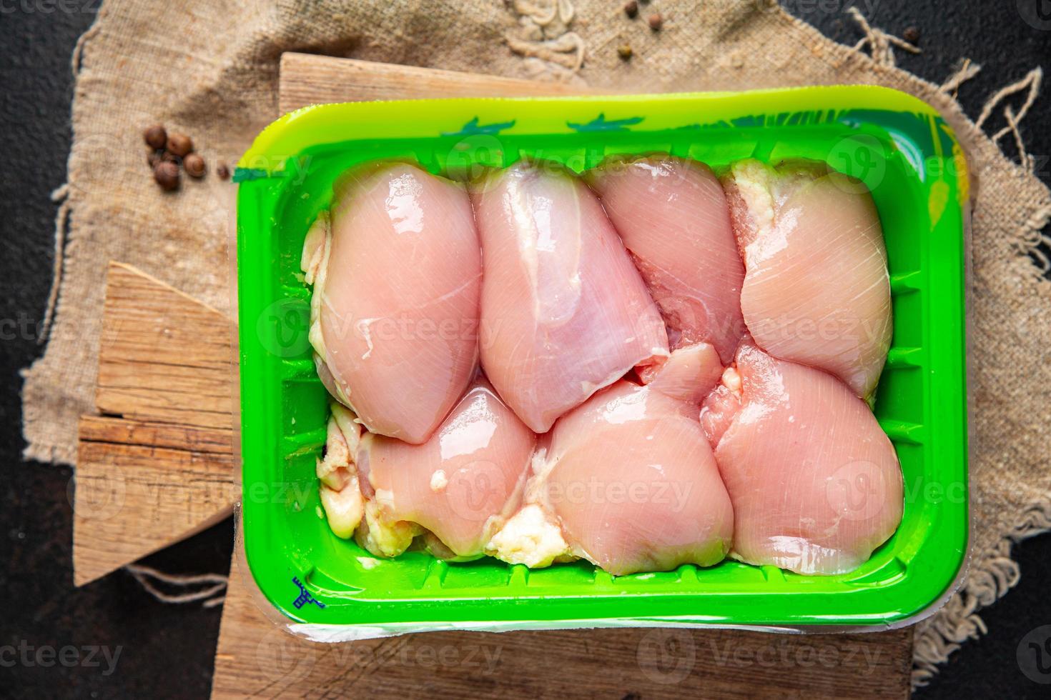 raw chicken meat boneless thigh photo