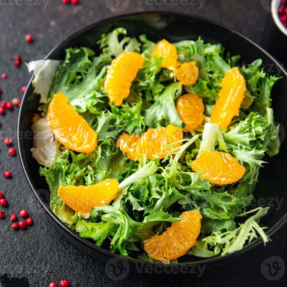 salad citrus lettuce, mix leaves, tangerine or orange meal photo