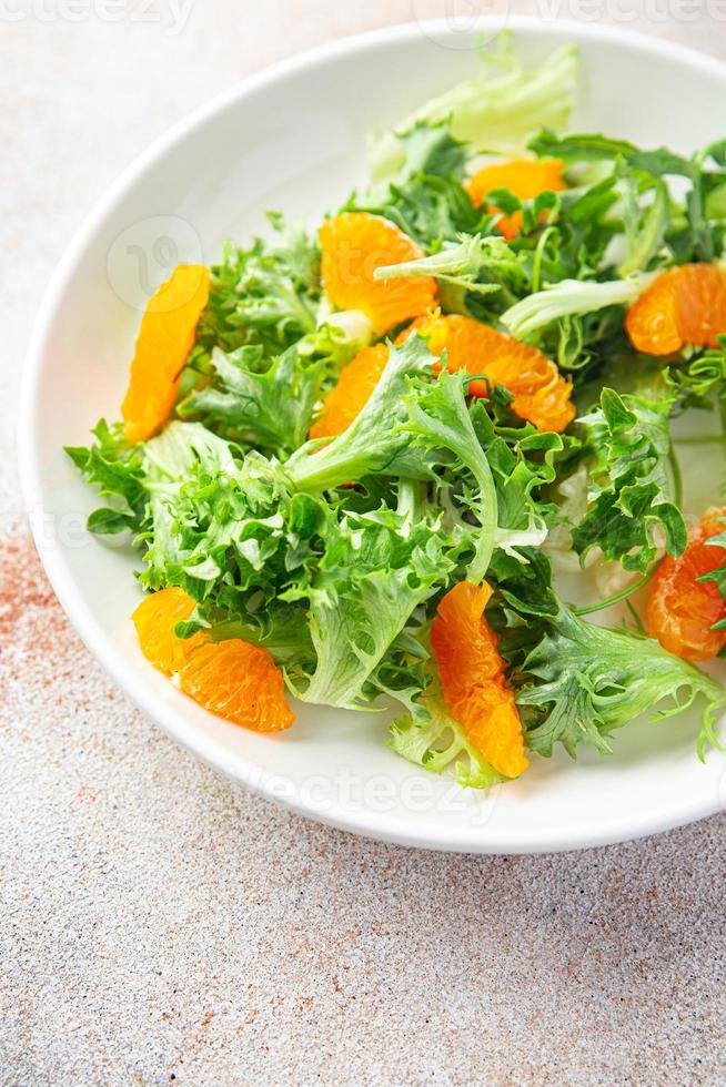 salad citrus lettuce, mix leaves, tangerine or orange meal photo