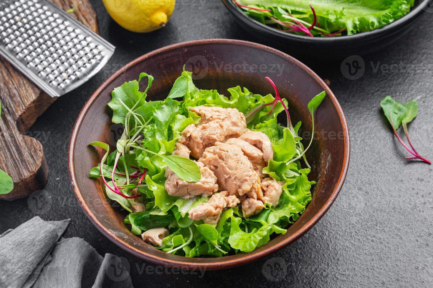 Cod liver salad seafood mix lettuce leaves photo