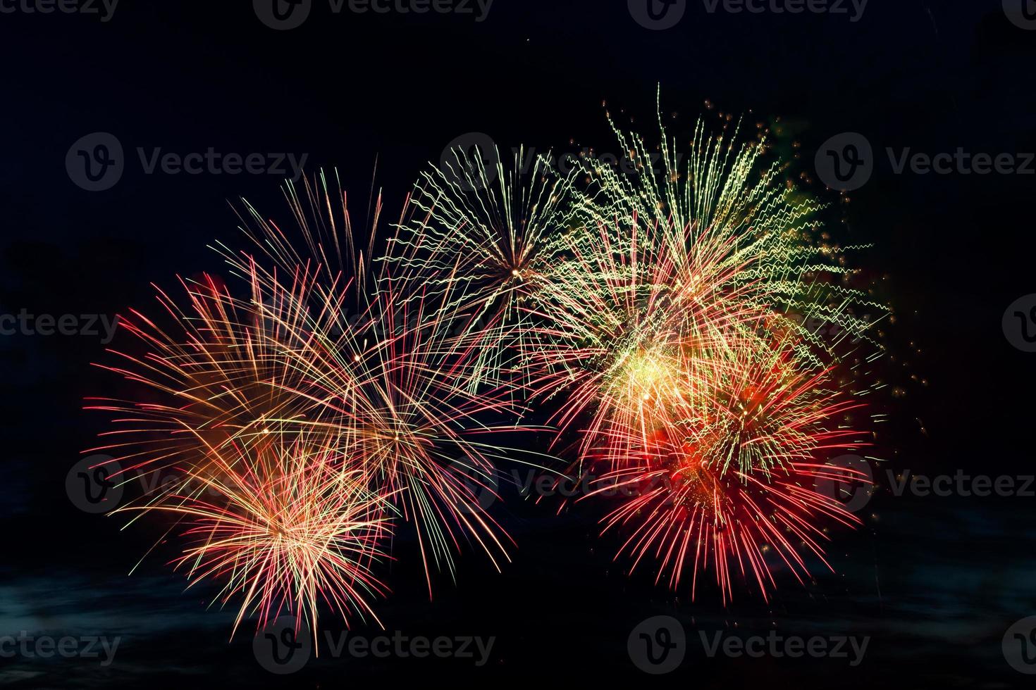 Bright colored fireworks on black background. photo