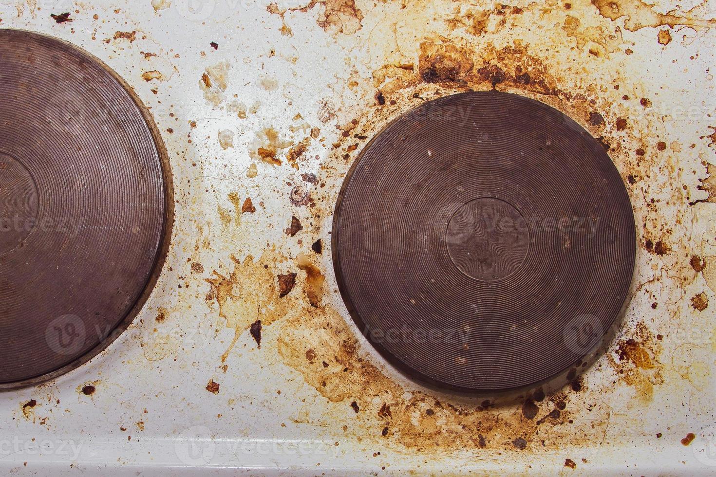 Dirt and grease on the white stove photo