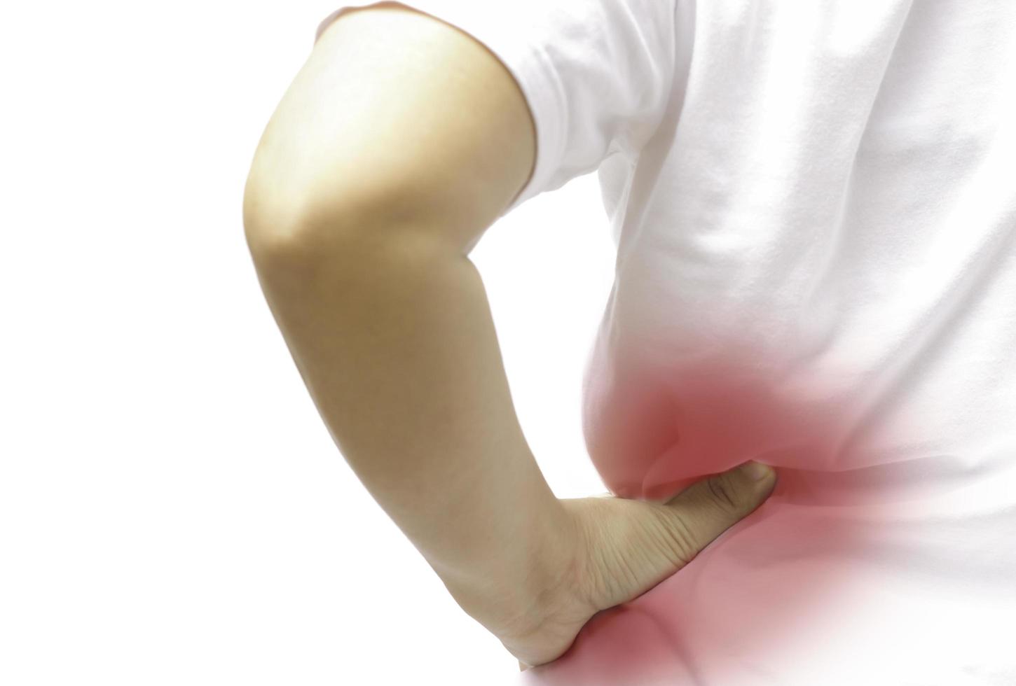 Woman feel pain on her back isloated in clipping path. photo