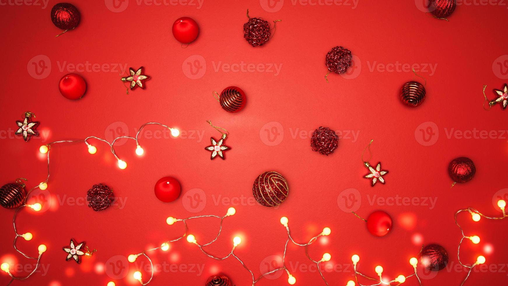 Merry Christmas and Happy New Year. background design with ornaments the ball red decorations On a red background with copy space for your text. Led lights photo