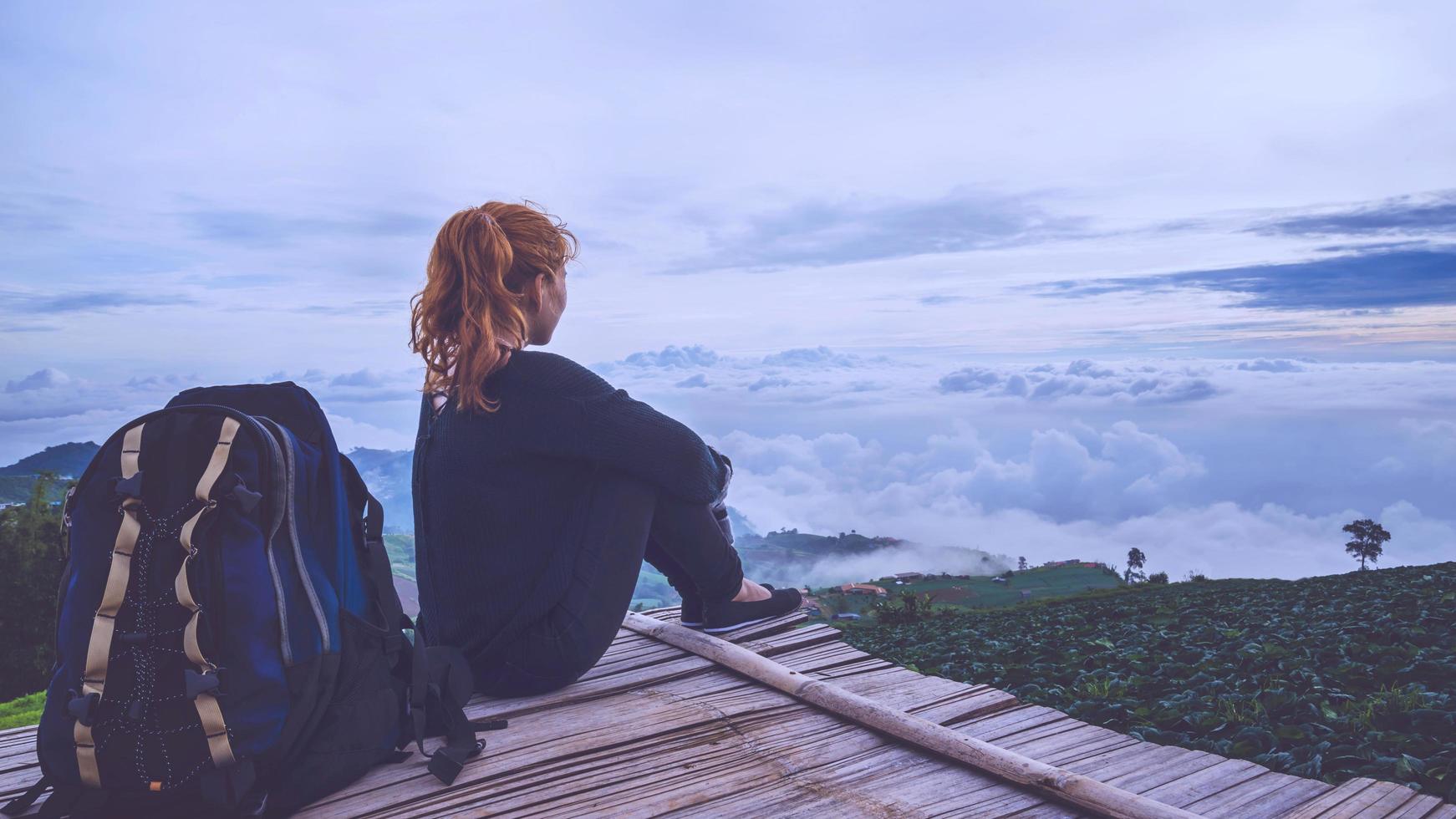 Asian women travel relax. Morning atmosphere nature Forests, mountains. Phu Thap Buek Thailand photo