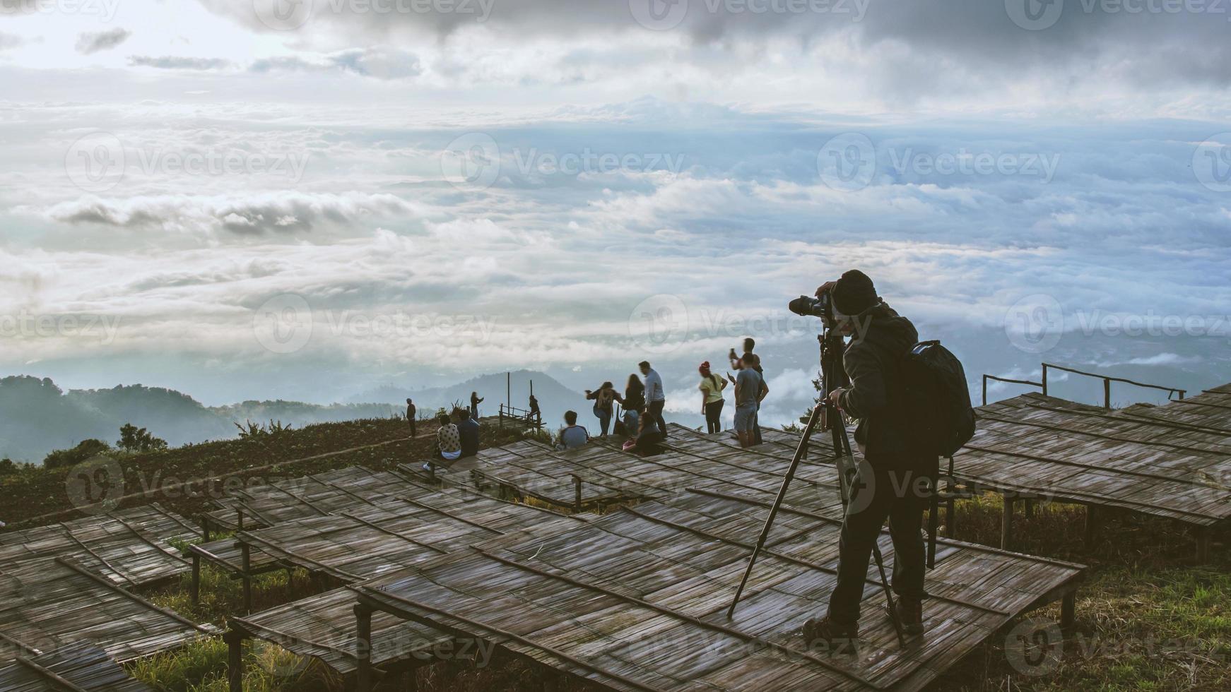 man asians travel relax in the holiday. Photograph landscape on the Moutain.Thailand photo