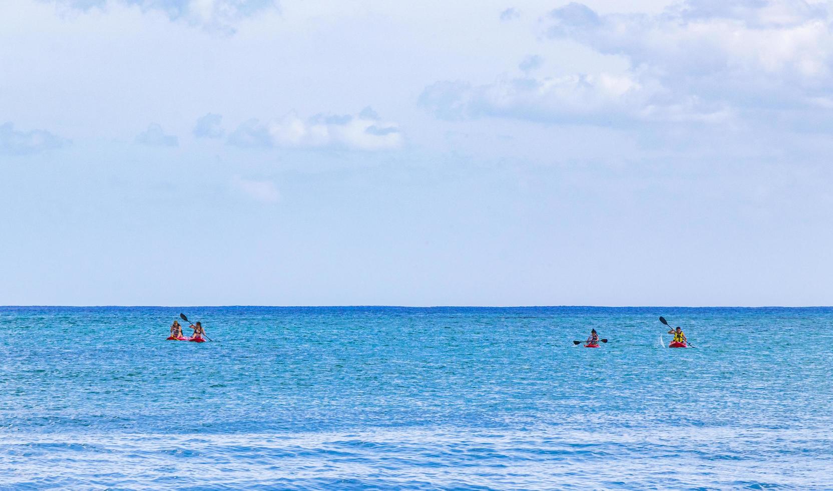 Playa del Carmen, Mexico, May 28 2021 - Red canoes on the beach photo