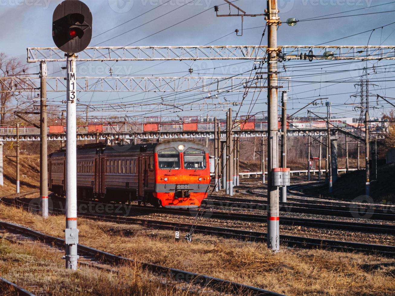 Old passenger train traveling through the industrial area. photo