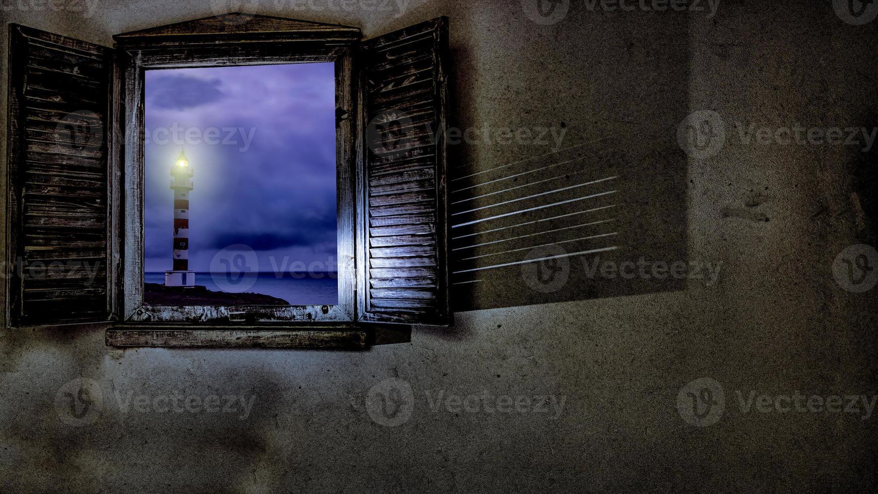 lighthouse through the window in gran canaria island photo