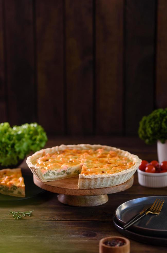 Delicious fresh quiche with broccoli, salmon and cheese photo