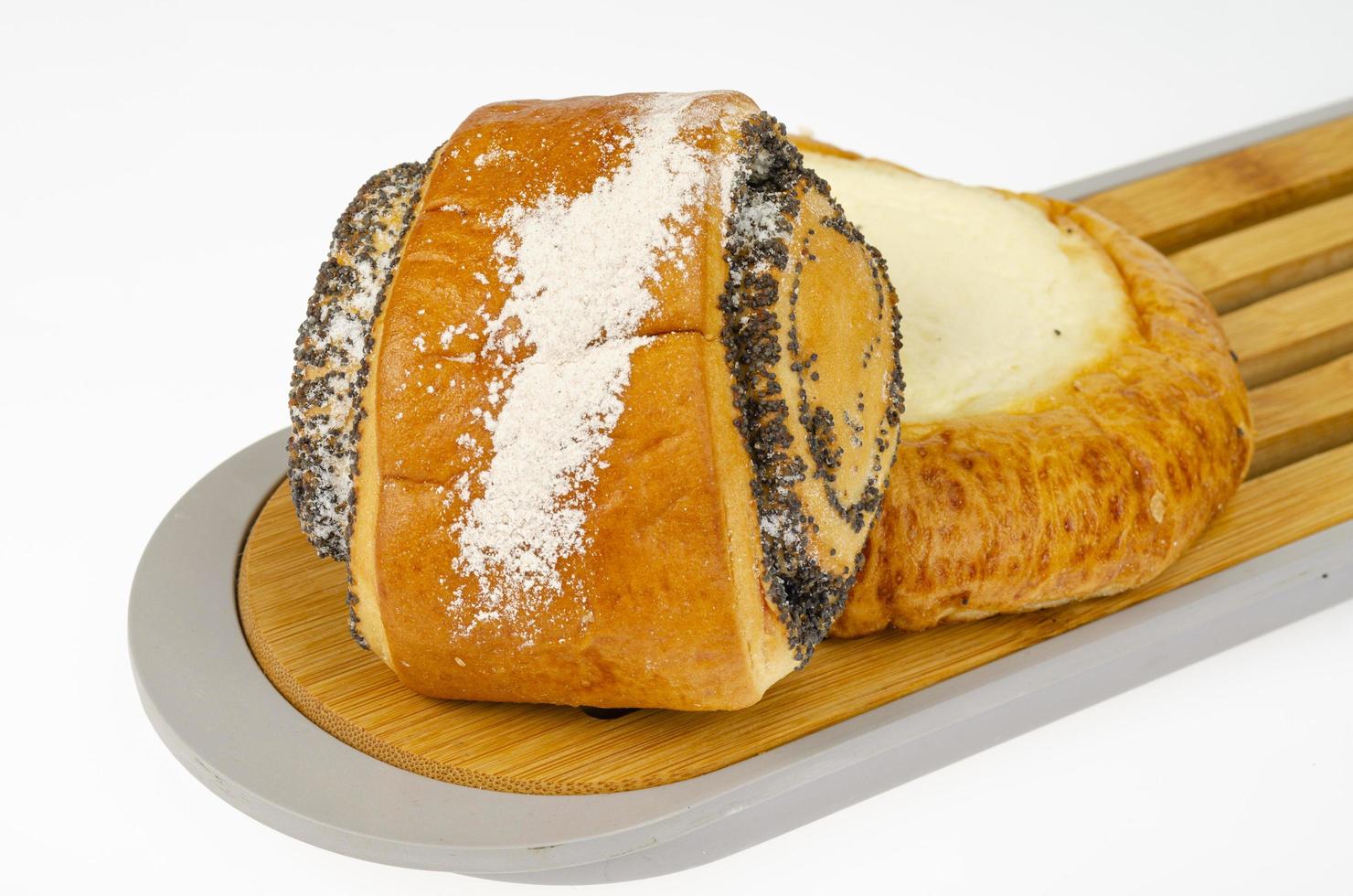 Fresh delicious homemade pastries, poppy seed bun. Studio Photo