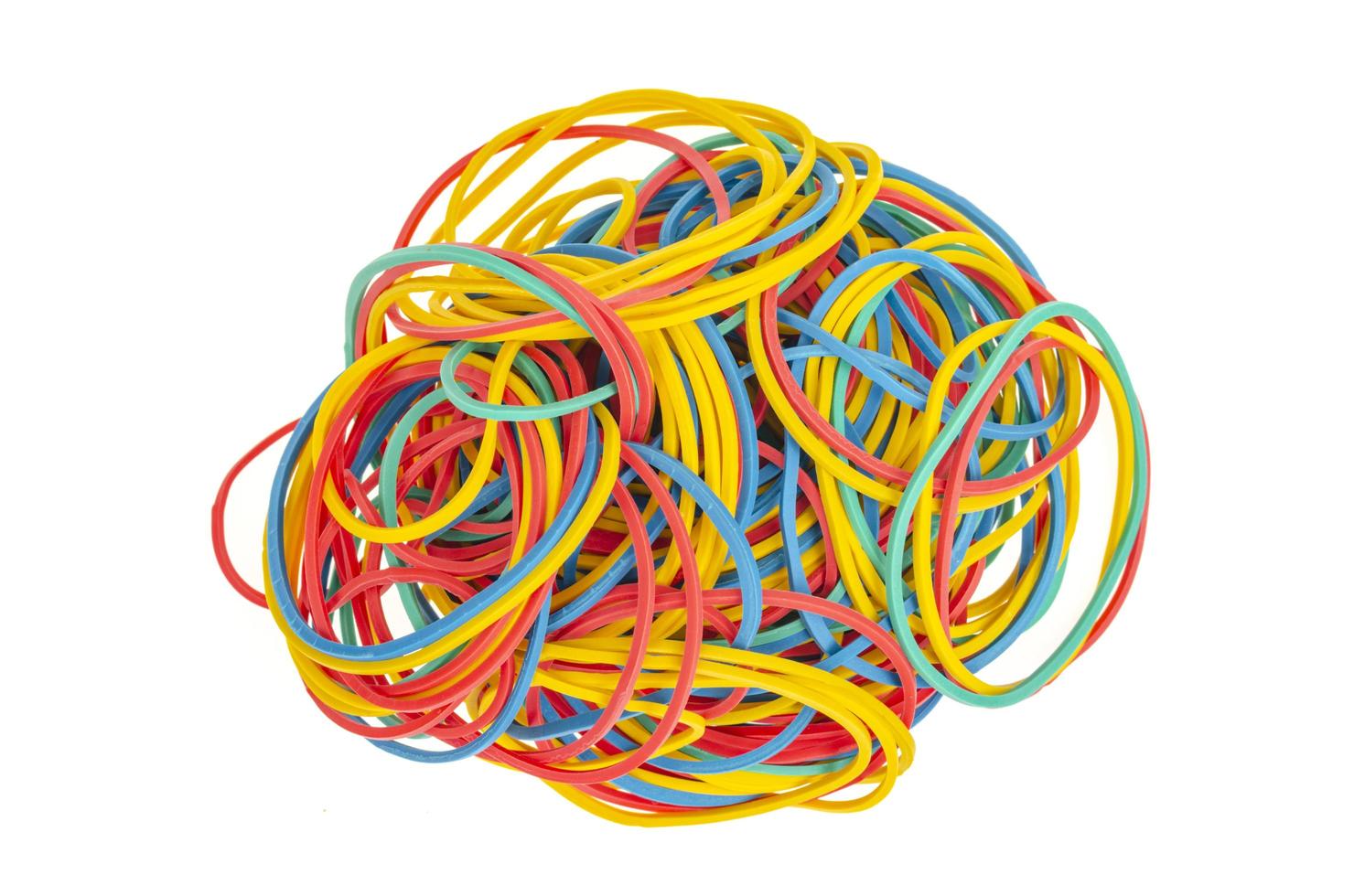 Many colourful multi coloured elastic rubber bands on white background. photo