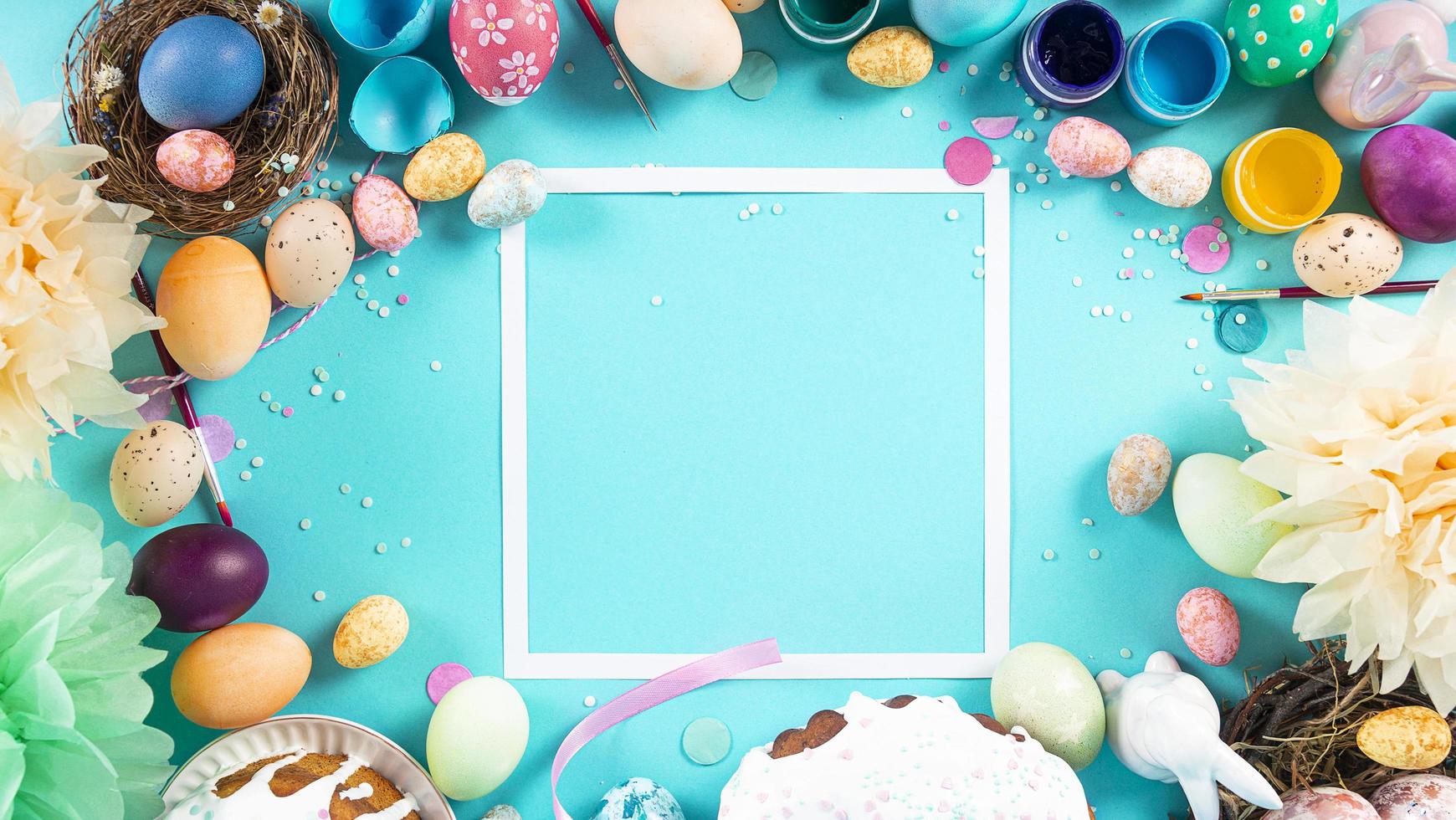 Colorful background with Easter eggs on light blue background. Happy Easter concept. Can be used as poster, background, holiday card. Flat lay, top view, copy space. Studio Photo