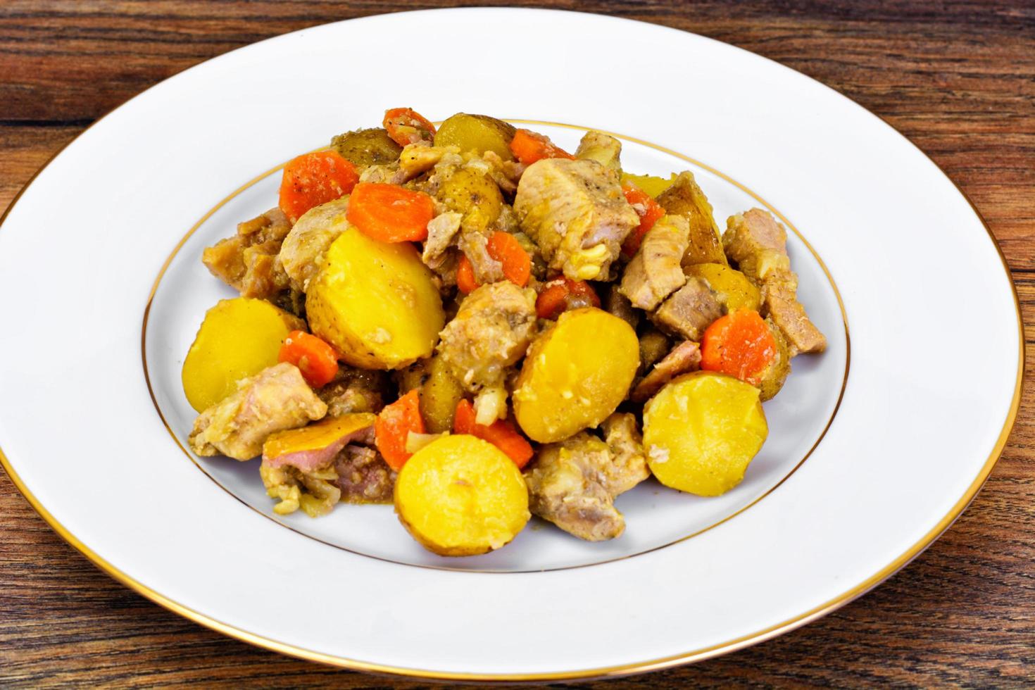 Stewed Quince with Potatoes, Carrots, Onions and Meat photo