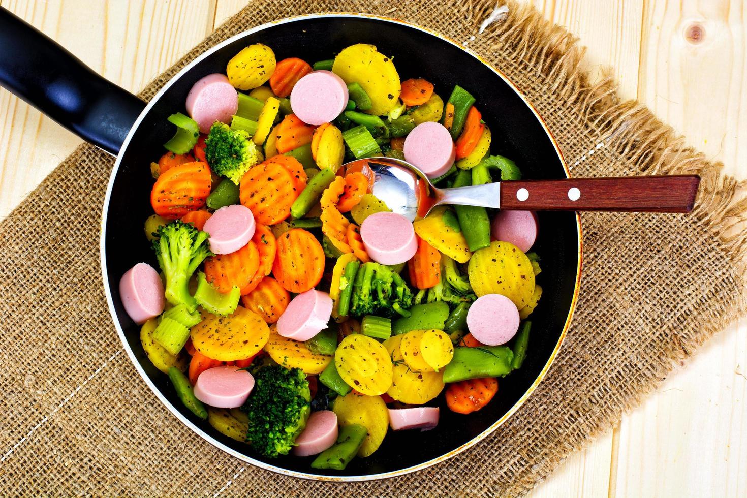 Steamed Vegetables Potatoes, Carrots and Broccoli with Sausages photo