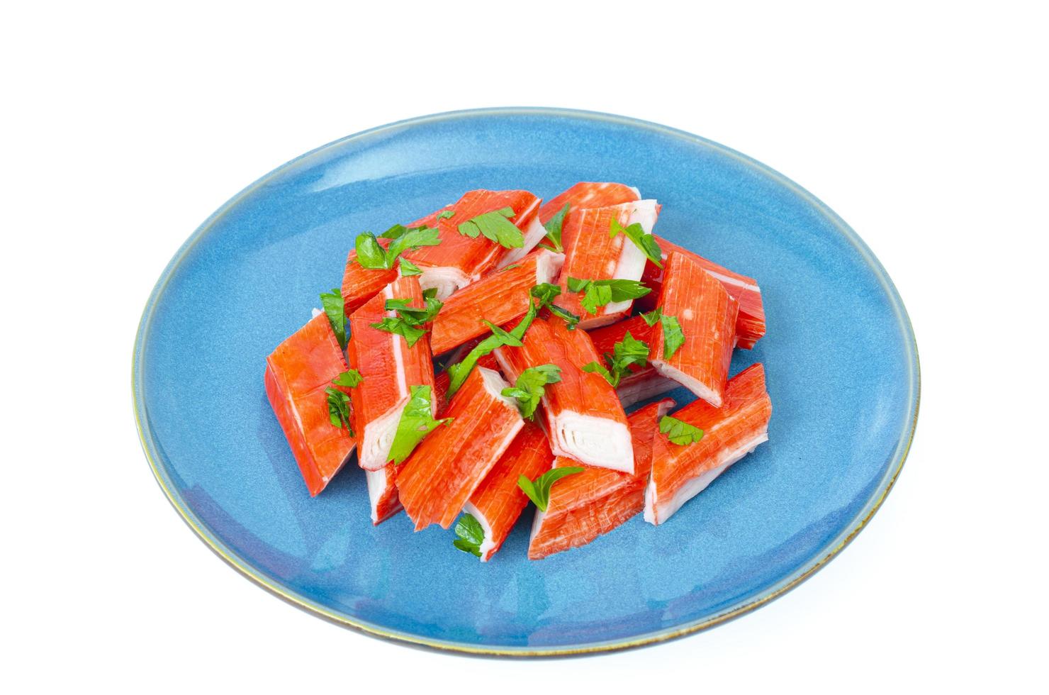 Crab sticks, surimi, imitation, snack on plate. Studio Photo