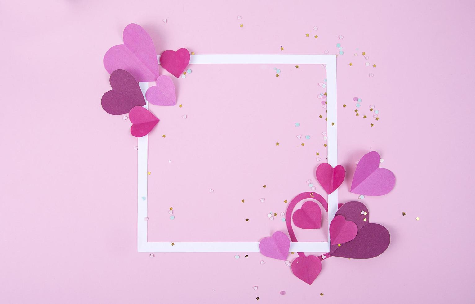 Abstract Background with Paper Hearts and Empty White Frame for Valentine s Day. Pink Love and Feeling Background for poster, banner, post, card photo