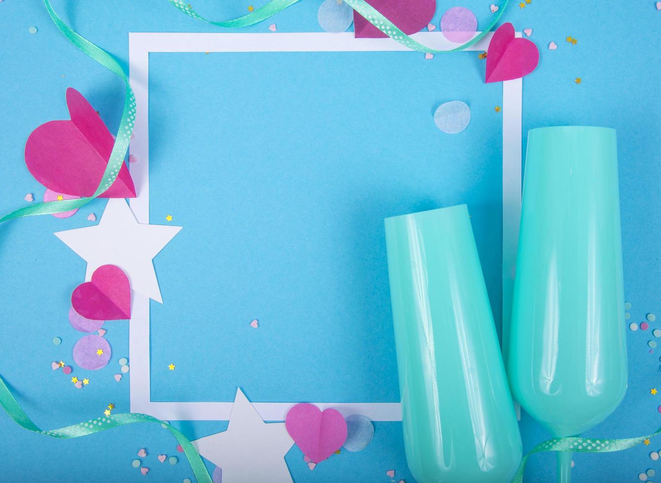 Abstract Background with Paper Hearts, frame, blue champagne glasses for Valentine s Day. Pink Love and Feeling Background for poster, banner, post, card. Top view photo