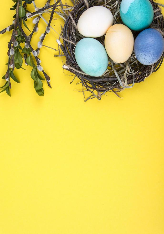 Colorful background with Easter eggs on yellow background. Happy Easter concept. Can be used as poster, background, holiday card photo