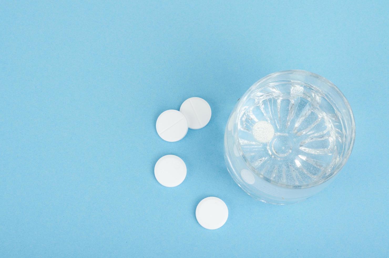 White round tablets, soluble in glass of water. Studio Photo
