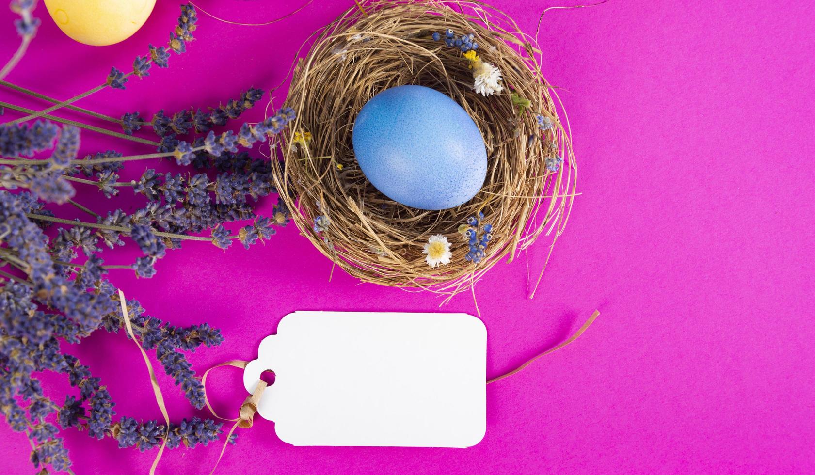 Colorful background with Easter eggs on pink background. Happy Easter concept. Can be used as poster, background, holiday card. Flat lay, top view, copy space. Studio Photo