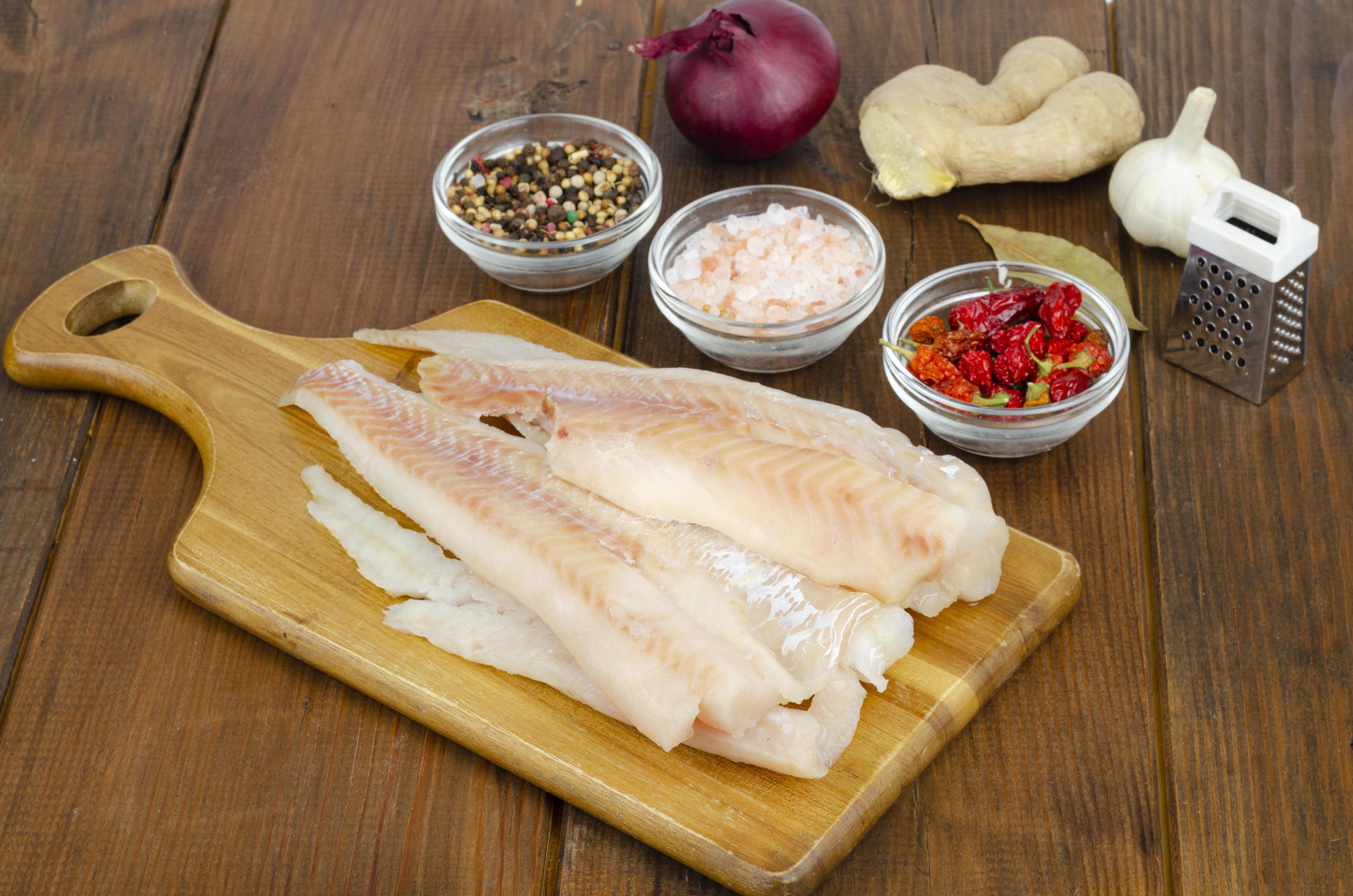 Frozen pollock fillet. Cooking fish dishes. Studio Photo 4410512 Stock Photo at Vecteezy