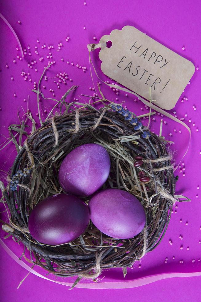 Colorful background with Easter eggs on lavender background. Happy Easter concept. Can be used as poster, background, holiday card. Studio Photo