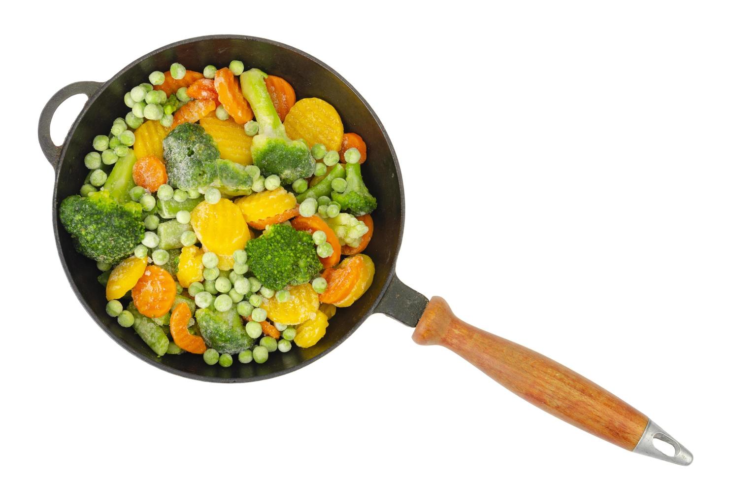 Pan with frozen pieces of vegetables isolated on white background. Studio Photo