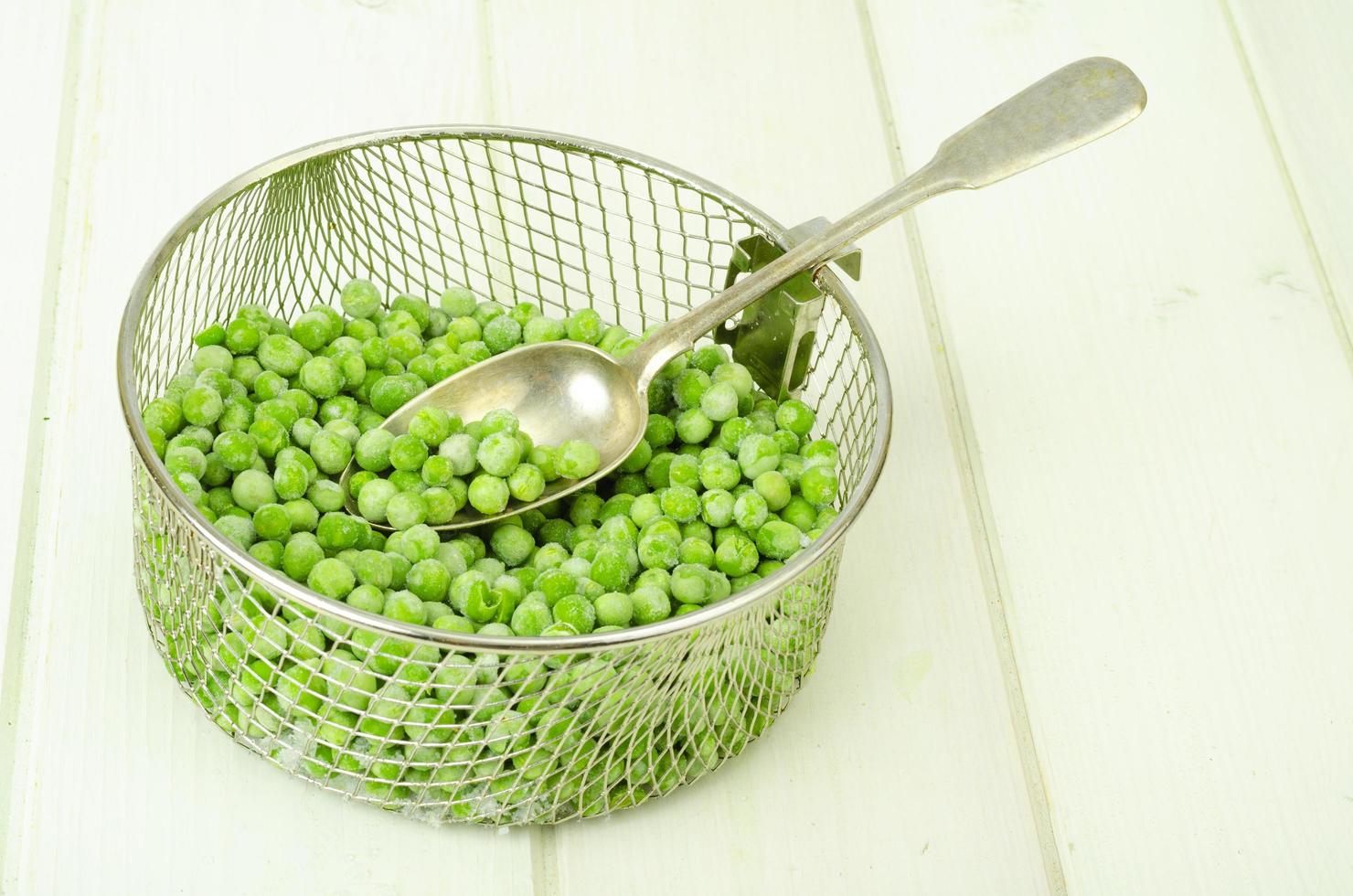 Preservation of vitamins. Frozen green peas. Organic vegetables. Studio Photo