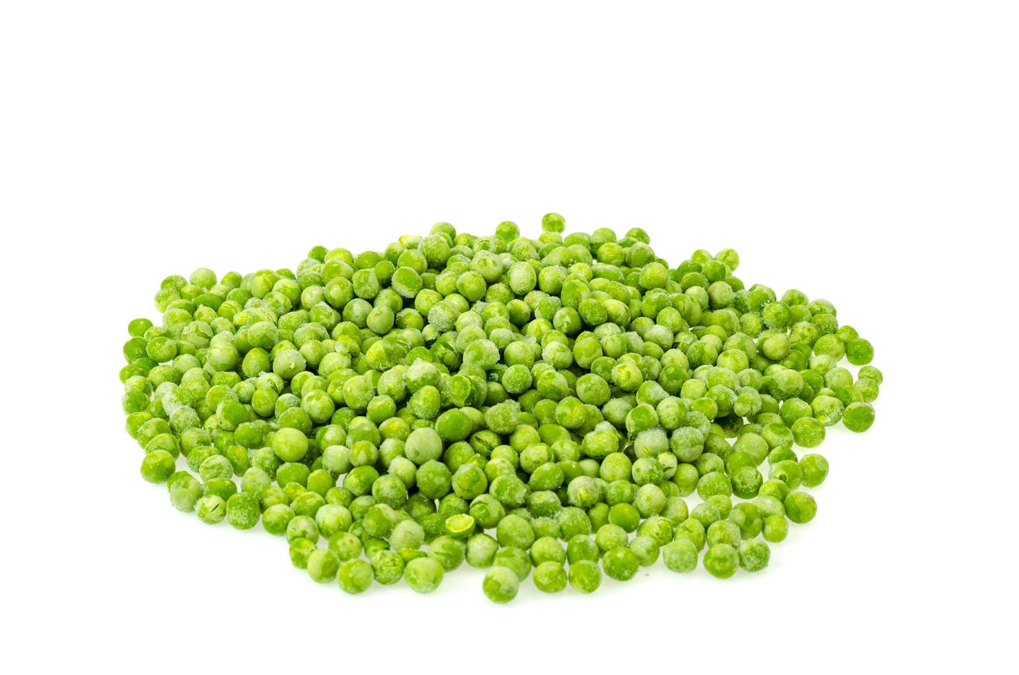 Pile of frozen blanched green peas isolated on white background. Healthy food. Studio Photo