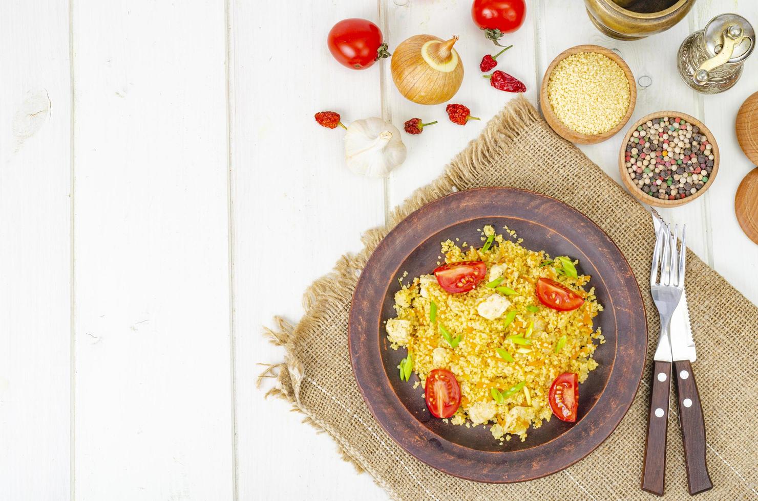 Healthy food. Couscous with chicken and vegetables. Studio Photo