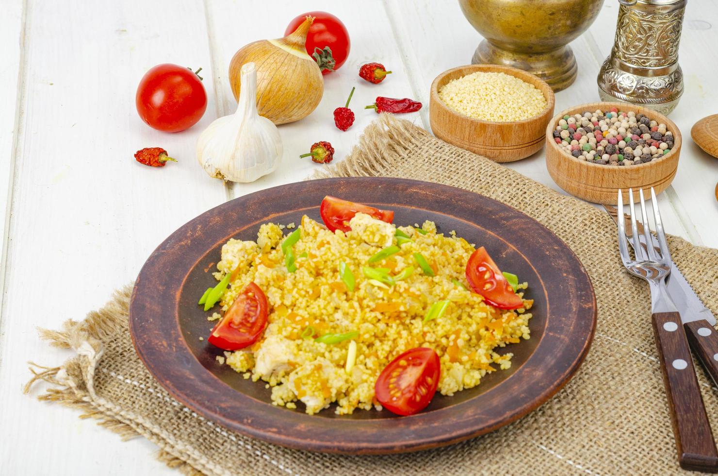 Healthy food. Couscous with chicken and vegetables. Studio Photo