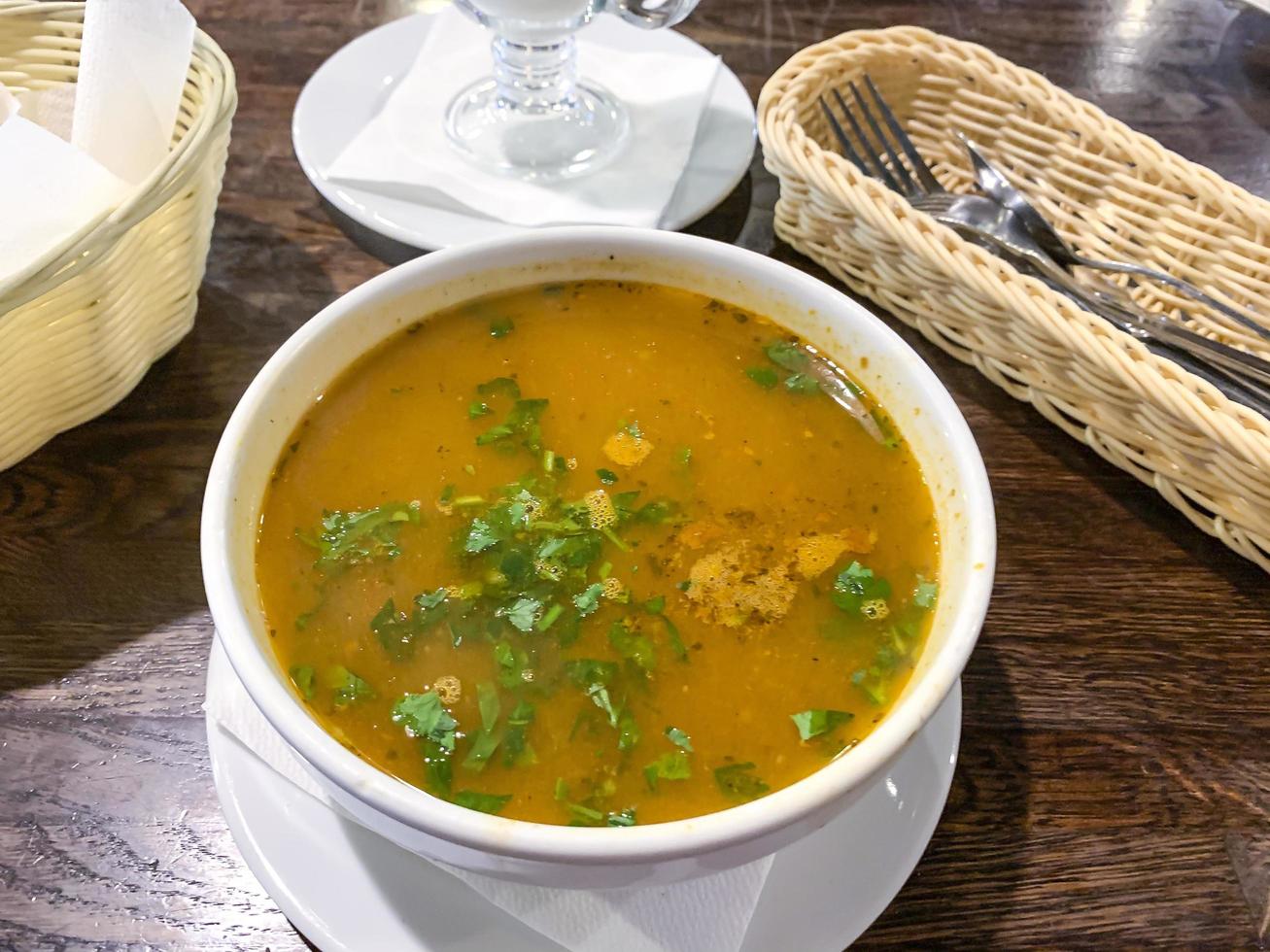 Hot spicy soup kharcho in white tureen, Georgian cuisine photo