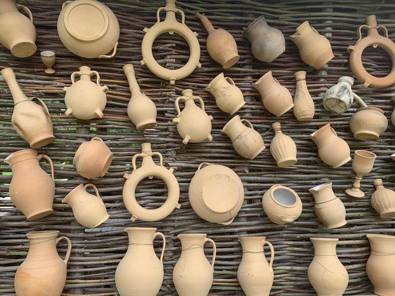 Decorative wall with clay jugs. Studio Photo background