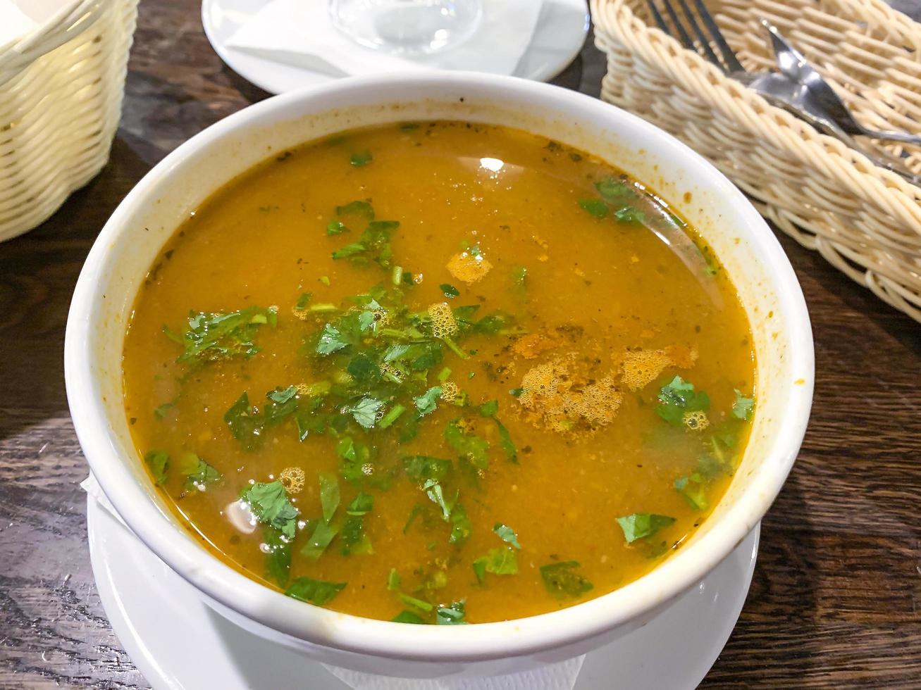 Hot spicy soup kharcho in white tureen, Georgian cuisine photo