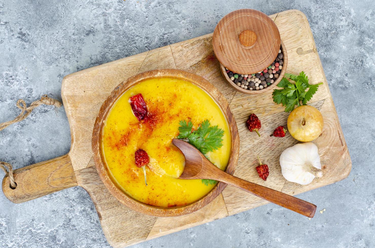 Spicy pumpkin puree soup with curry and saffron. Studio Photo. photo